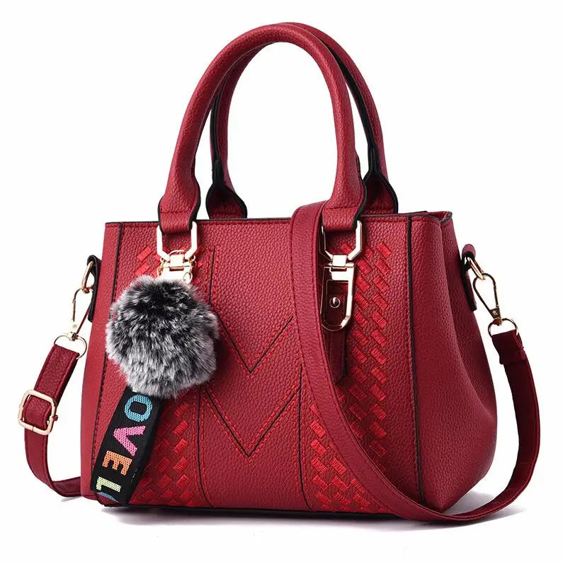 Women’s Embroidered Leather Messenger Bag with Pom Pom Detail