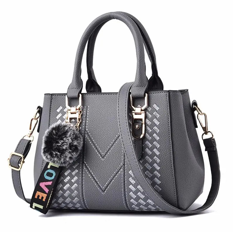 Women’s Embroidered Leather Messenger Bag with Pom Pom Detail