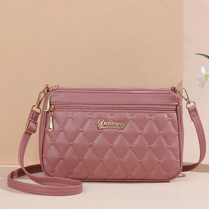 Women’s Embroidered Leather Messenger Bag with Pom Pom Detail