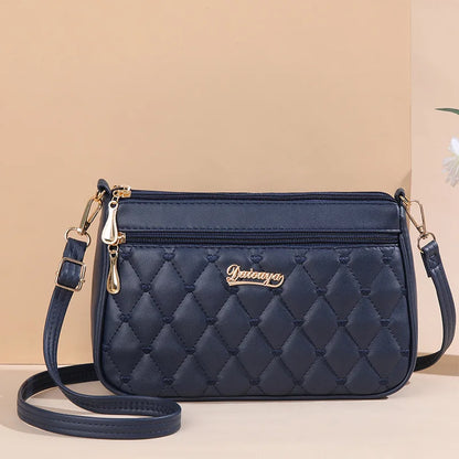 Women’s Embroidered Leather Messenger Bag with Pom Pom Detail
