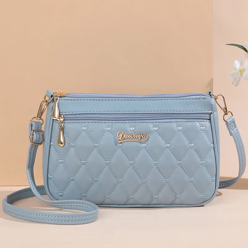Women’s Embroidered Leather Messenger Bag with Pom Pom Detail