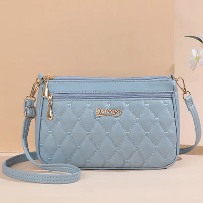Women’s Embroidered Leather Messenger Bag with Pom Pom Detail