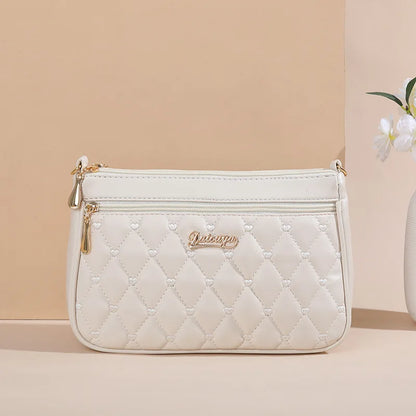 Women’s Embroidered Leather Messenger Bag with Pom Pom Detail