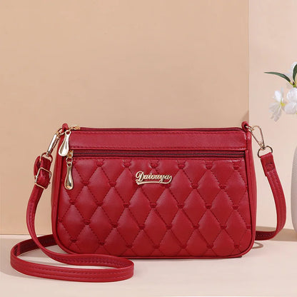 Women’s Embroidered Leather Messenger Bag with Pom Pom Detail