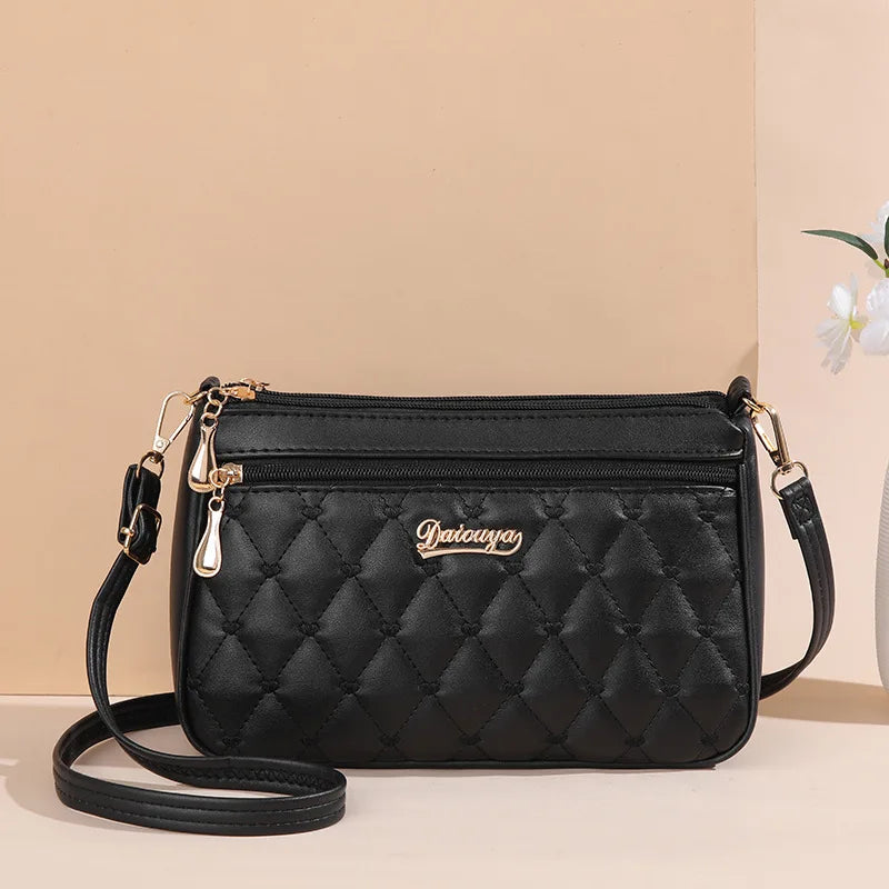 Women’s Embroidered Leather Messenger Bag with Pom Pom Detail